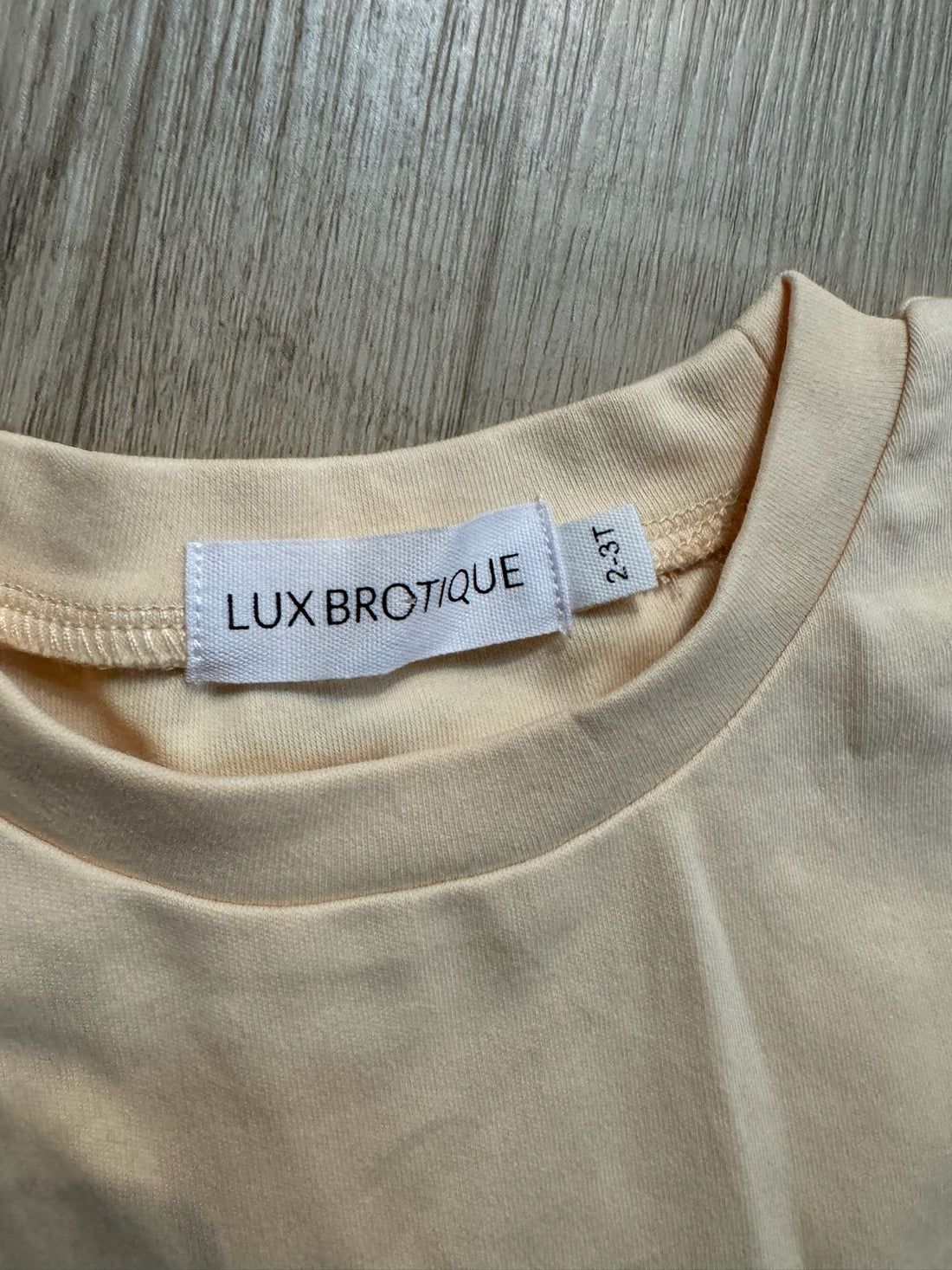 Boutique Cream Checkered Sleeve Top